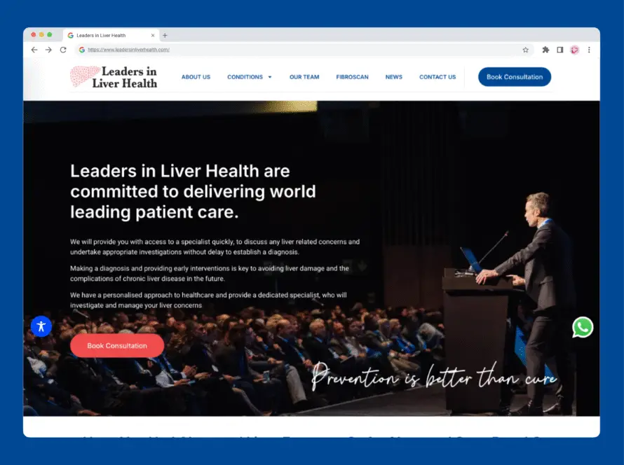 A man in a suit speaks at a lectern on stage to a seated audience in an auditorium. The website shown is for Leaders in Liver Health, with information about liver disease patient care, navigation links, and a prominent Book Consultation button.